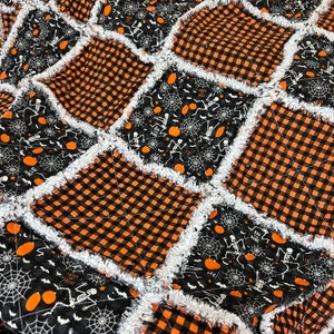 Halloween rag quilt throw bad to the bone dancing skeletons black orange white