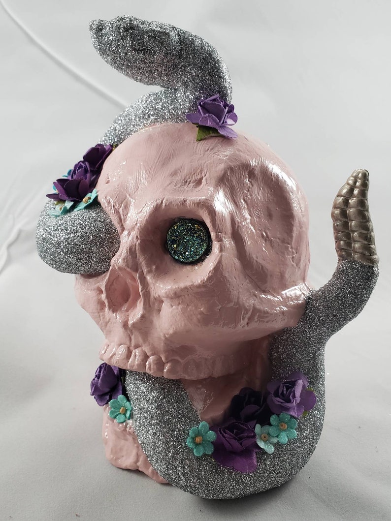 Light pink skull with silver snake