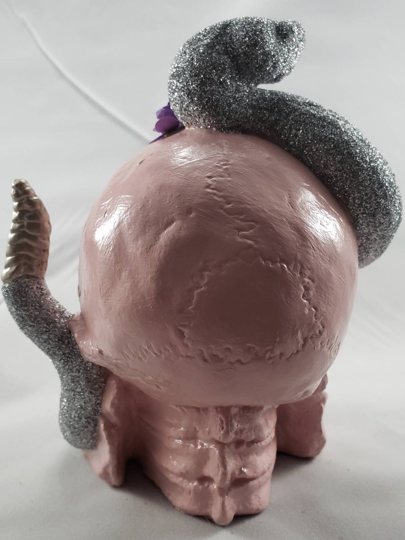Light pink skull with silver snake