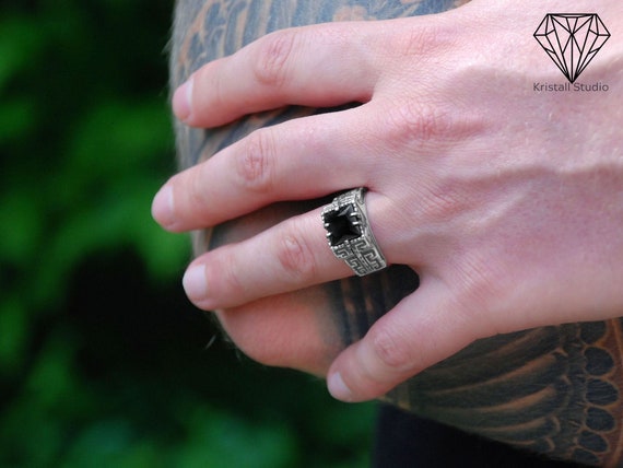 Men's silver ring with onyx stone with a sophisticated design