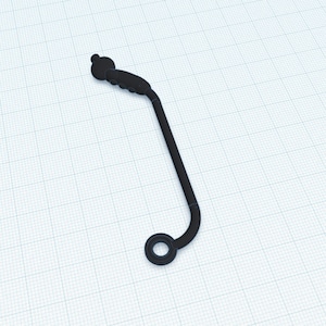 May include: A black metal pipe with a round end and a small, round knob at the other end.