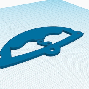 May include: A blue plastic part with a curved shape and two holes. The part is designed for a 3D printed project.