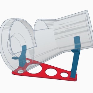 May include: A clear plastic tube with a red and blue base. The tube is angled and appears to be a part of a toy or game.