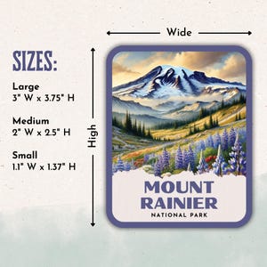 The image is a sticker or label for Mount Rainier National Park, depicting a scenic mountain landscape with a snowy peak, pine trees, and wildflowers.