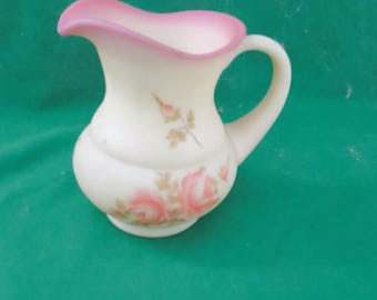 Fenton glassware, Burmese pattern, signed pitcher.