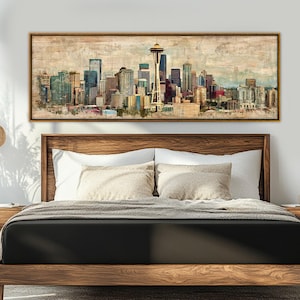 May include: A framed canvas print of a cityscape, featuring a skyline with tall buildings and a prominent Space Needle. The artwork has a vintage, watercolor style with muted colors, and is displayed above a wooden bed frame.