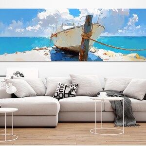 May include: A white boat with a weathered wooden post tied to it, resting on a sandy beach with turquoise water and a blue sky with white clouds.