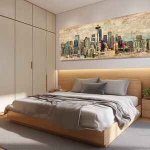 May include: A bedroom featuring a wooden bed frame, a large cityscape painting, and a light-colored wardrobe. The bed is made with gray bedding and pillows. The painting depicts a colorful skyline with a prominent tower.