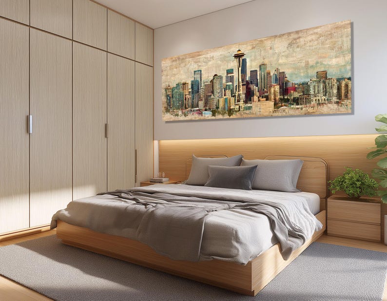 May include: A bedroom featuring a wooden bed frame, a large cityscape painting, and a light-colored wardrobe. The bed is made with gray bedding and pillows. The painting depicts a colorful skyline with a prominent tower.