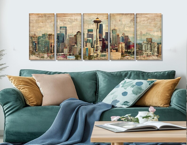 May include: Five-panel wall art featuring a vintage-style depiction of a city skyline, including the Space Needle. The artwork showcases a muted color palette with shades of beige, brown, and blue, creating a textured, aged appearance. The panels are displayed above a teal sofa.
