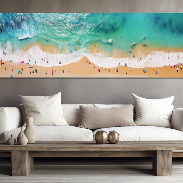 May include: An aerial view of a beach with turquoise water and white waves crashing on the shore. The sand is light brown and there are many people on the beach, some swimming in the water, others sunbathing on the sand.