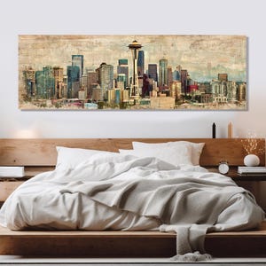 May include: A large rectangular wall art print depicting the Seattle skyline. The artwork features a vintage, textured style with a muted color palette of beige, blue, and brown. The Space Needle is prominently displayed.