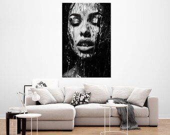 May include: Black and white art print of a person with closed eyes, water or a liquid substance cascading down their face. The image is a close-up, emphasizing the texture and details of the liquid and the person's features. The artwork is displayed on a white wall.