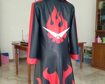 May include: Black and red cosplay coat with a flame design. The coat features a white collar and red accents along the sleeves and hem. A large flame graphic is on the back, with a white and red emblem. The coat is displayed on a mannequin.