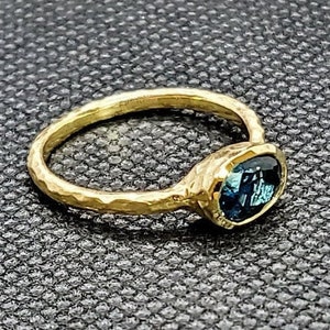 14k solid yellow gold hammered ring with 1.10 ct. 7x5 mm oval shape natural AAA London blue topaz.