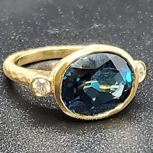 14k solid yellow gold hammered ring with 0.17 ct. SI1 clarity, G color natural brilliant diamonds & 6.60 ct. AAA natural London blue topaz.