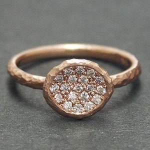 14k solid rose gold hammered ring with 0.20 ct. SI1, G color natural brilliant diamonds.