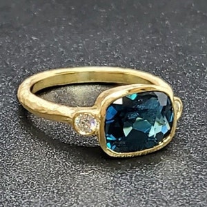 14k solid yellow gold hammered ring with 0.17 ct. SI1 clarity, G color natural brilliant diamonds & 2.60 ct. AAA natural London blue topaz.