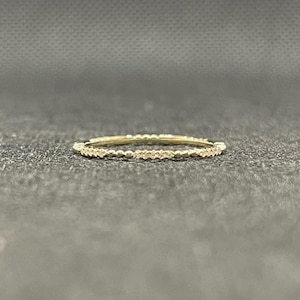 14k solid yellow gold eternity band with 0.11 ct. SI1 clarity, G color natural brilliant diamonds