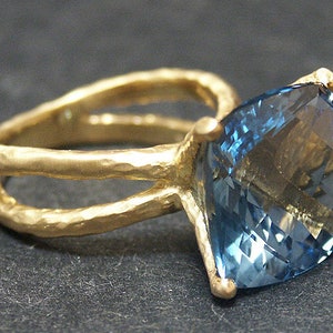 14k solid yellow gold hammered split shank ring with 12.90 ct. 14x14 mm cushion shape natural AAA Swiss blue topaz.