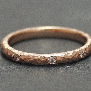 14k solid rose gold hammered eternity band with 0.13 ct. SI1 clarity, G color natural brilliant diamonds.