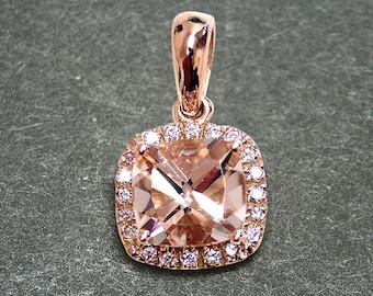 May include: A rose gold pendant featuring a square-shaped morganite gemstone surrounded by a halo of smaller diamonds.