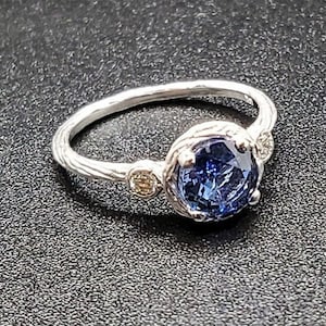 14k solid white gold textured ring with 0.05 ct. SI1 clarity, G color natural brilliant diamonds & 1.20 ct. natural AAAA Ceylon sapphire.