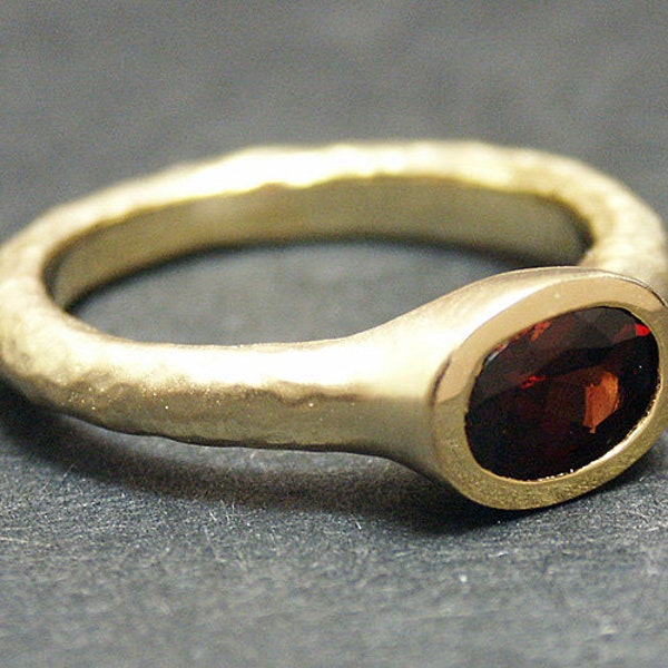 14k solid yellow gold hammered ring with 1.10 ct. 7x5 mm oval shape natural AAA garnet.