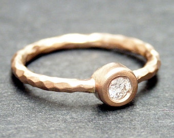 14k solid rose gold hammered ring with 0.10 ct. SI1 clarity, G color natural brilliant diamond.