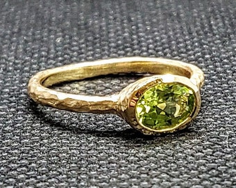 14k solid yellow gold hammered ring with 0.71 ct. 7x5 mm oval shape natural AAA peridot.