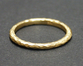 14k solid yellow gold hammered band.