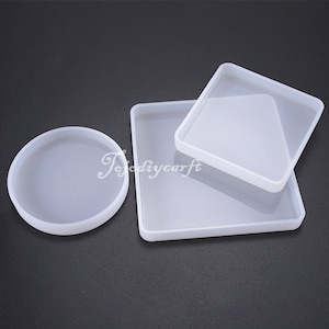 May include: Three silicone moulds for resin crafts. The moulds are a round shape, a square shape, and a larger square shape.