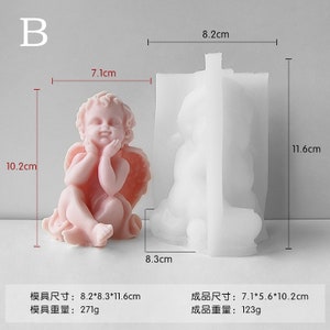 May include: A white silicone mould for making a resin sculpture of a cherub. The mould is 8.2 cm by 8.3 cm by 11.6 cm. The finished resin sculpture is 7.1 cm by 5.6 cm by 10.2 cm.