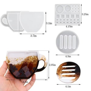 May include: Set of four silicone molds for resin crafts. The molds are shaped like a coffee cup, a coaster, a tray with three rectangular slots, and a tray with multiple round and square shapes. The molds are 3.25 inches wide and 4.15 inches long.
