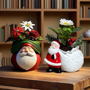 May include: Two decorative planters shaped like Santa Claus. The left planter is a red Santa head with a green sack holding poinsettias and a white flower. The right planter is a full-body Santa carrying a white sack with snowflake patterns and a daisy.