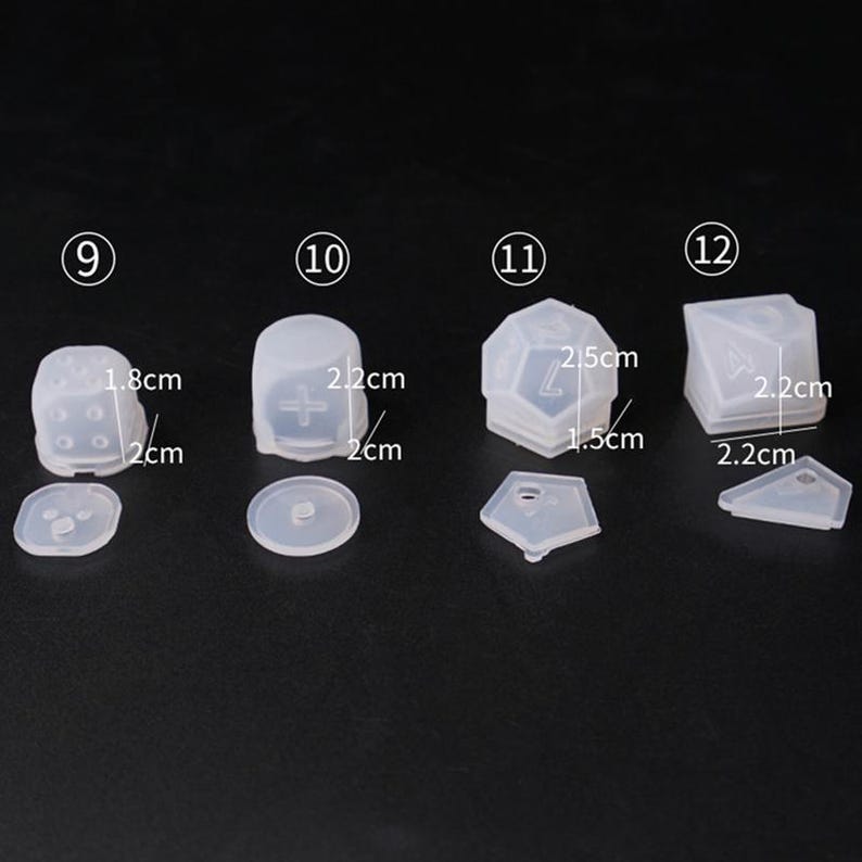 May include: Set of six clear silicone molds for making dice. The molds are numbered 9 through 12 and are different shapes and sizes. The molds are 1.5 to 2.5 inches in diameter.
