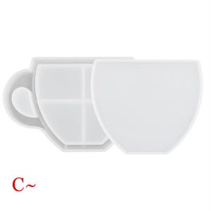 May include: White silicone mold shaped like a coffee cup with a handle. The mold is divided into four sections.