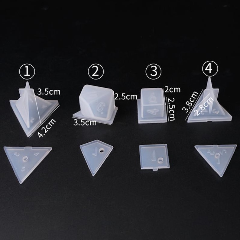 May include: Set of clear plastic molds for making resin dice. The molds are numbered 1 through 4 and include a variety of shapes, including a pyramid, cube, and triangle. The molds are approximately 2.5 cm to 4.2 cm in size.