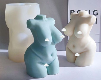 Puede incluir: Dos moldes de silicona para hacer velas con forma de torso femenino. Un molde es azul claro y el otro es blanco.