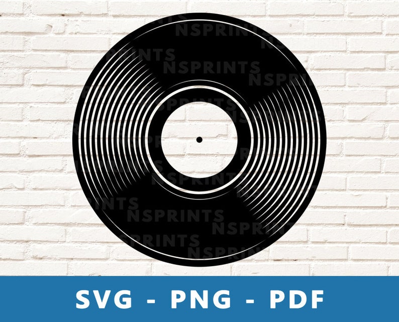 May include: A black vinyl record with a center hole and concentric circles. The record is isolated against a white brick wall background.