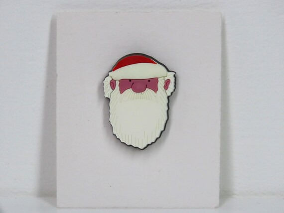 A vintage Raymond Briggs Father Christmas pin badge