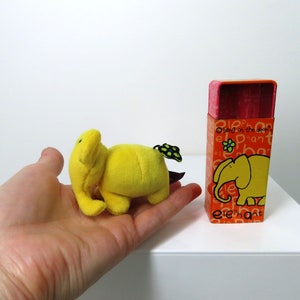A vintage 2003 Bang On The Door Tiny Tins Elephant toy.  Super cute!!