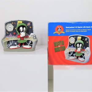 A vintage 1996 Marvin The Martian resin clock in original box, fully working.