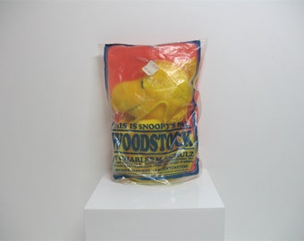 A Vintage 1970s Woodstock bag with original outer plastic bag.