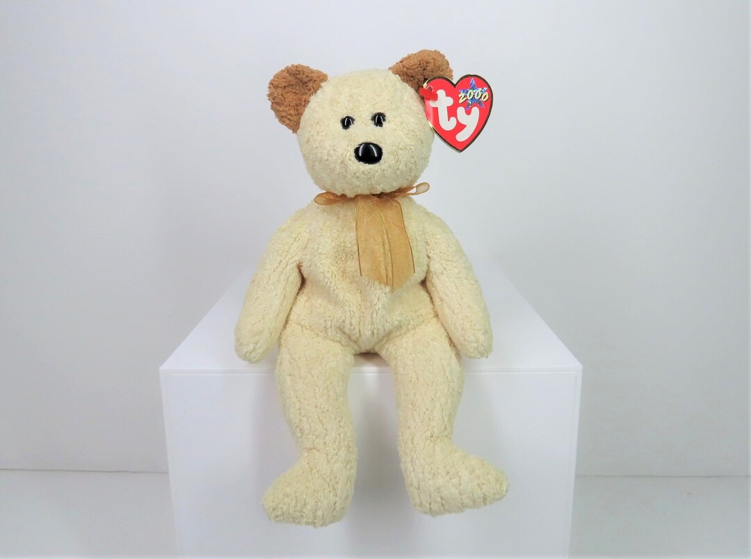 A Vintage 2000 Ty Beanie Babies Small Teddy Bear Named Huggy, With
