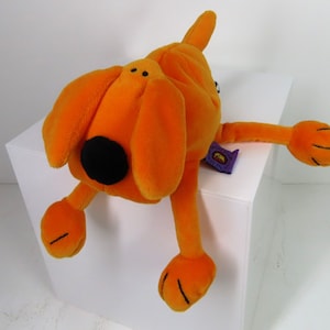 A vintage 1999 Bang on the Door Dog soft toy plush.