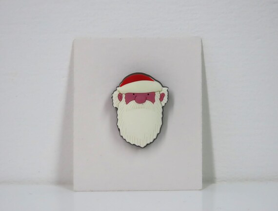A vintage Raymond Briggs Father Christmas pin badge
