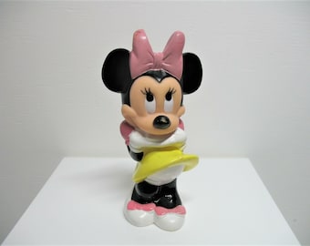 A vintage 1990s Minnie Mouse plastic toy figure.