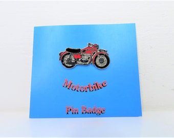 A vintage 1990s Wallace and Gromit metal enamelled motorbike pin.