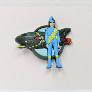 A vintage late 1990s - early 2000 Thunderbirds Virgil Tracy rubber pin.